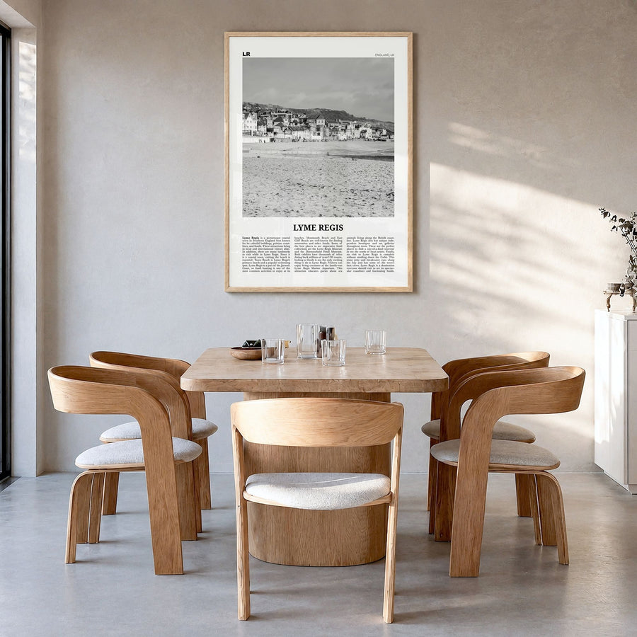 Lyme Regis Newspaper Poster in a natural wood frame, hanging in a dining room