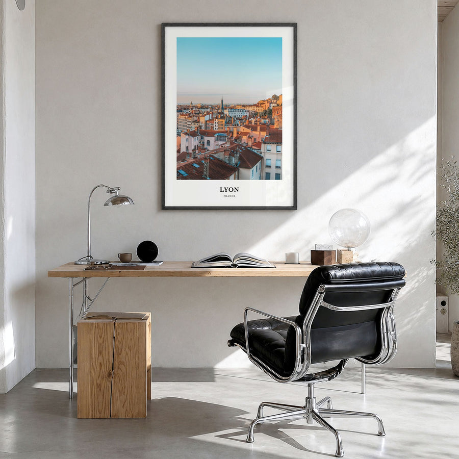 Lyon Classic Poster in a black wood frame, hanging in a bright home office