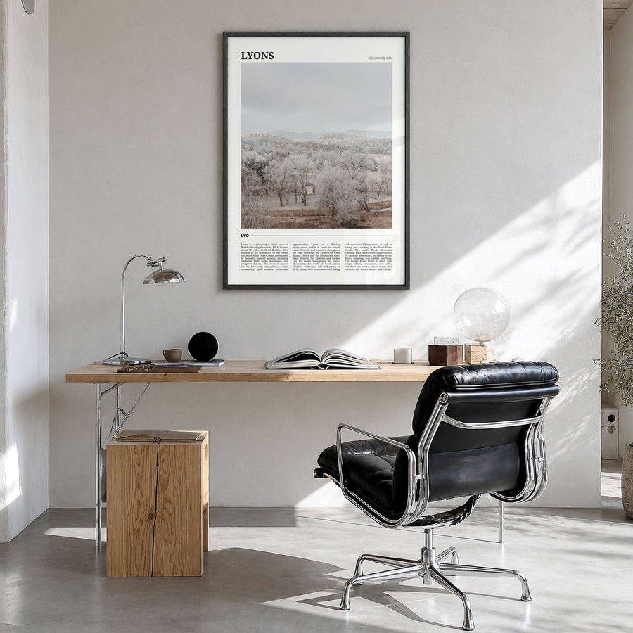 Lyons Travel Poster in a black wood frame, hanging in a bright home office