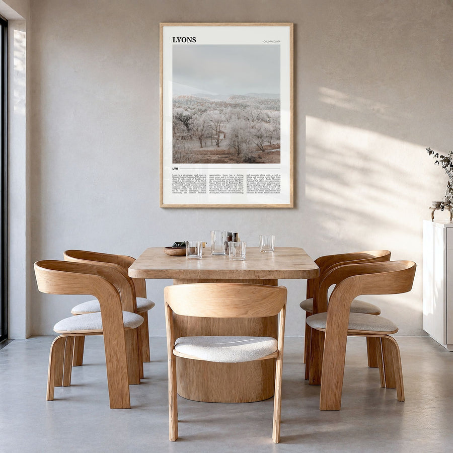 Lyons Travel Poster in a natural wood frame, hanging in a dining room
