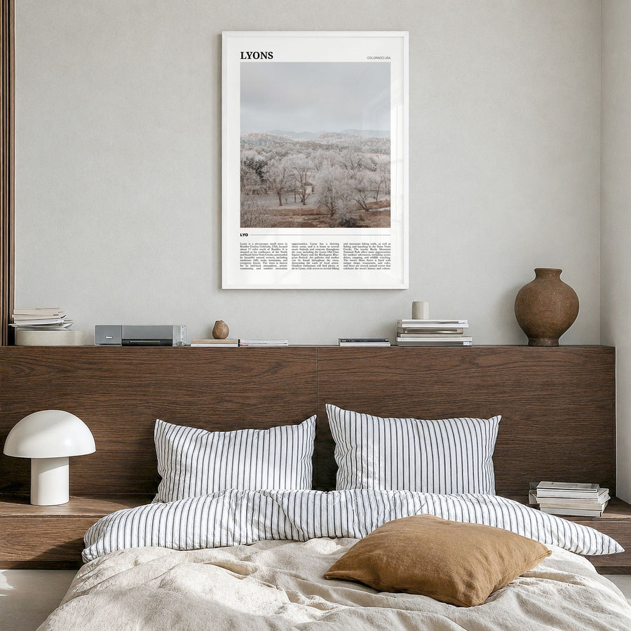 Lyons Travel Poster in a white wood frame, hanging in a bedroom