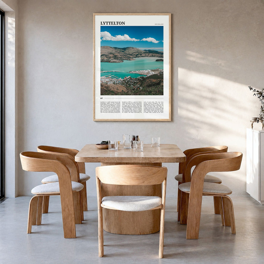 Lyttelton Travel Poster in a natural wood frame, hanging in a dining room