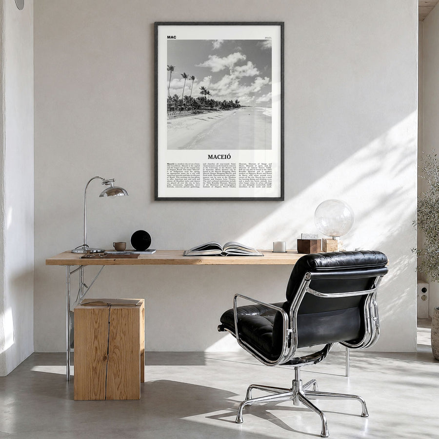 Maceió Newspaper Poster in a black wood frame, hanging in a bright home office