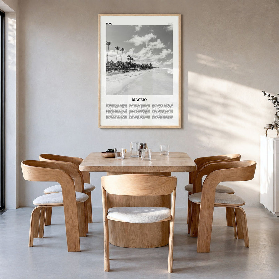 Maceió Newspaper Poster in a natural wood frame, hanging in a dining room