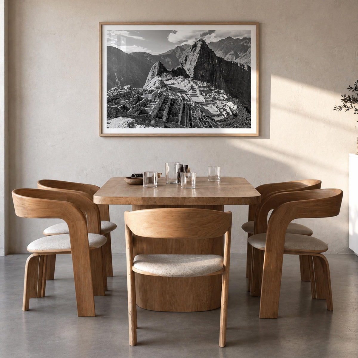 Machu Picchu black & white photo poster of Peru – horizontal wall art in natural wood frame with white border, hanging on wal