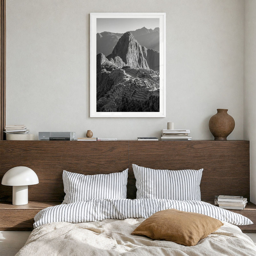Machu Picchu Photo Poster in a white wood frame, hanging in a bedroom, white border