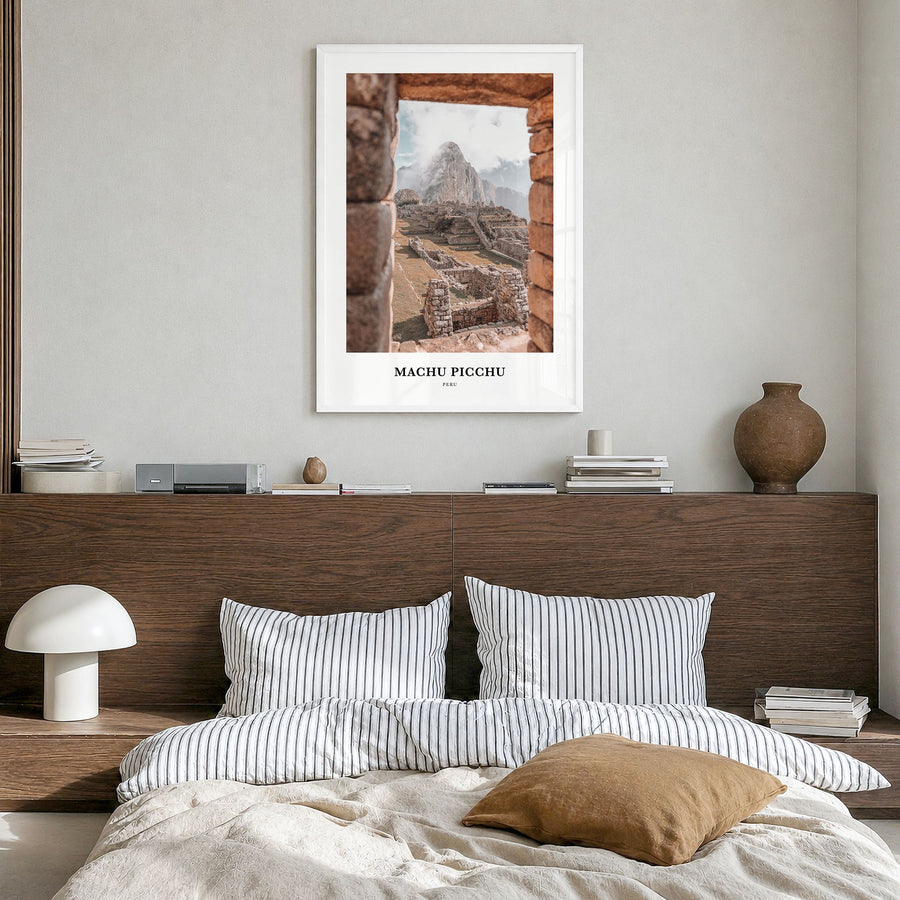 Machu Picchu Classic Poster in a white wood frame, hanging in a bedroom