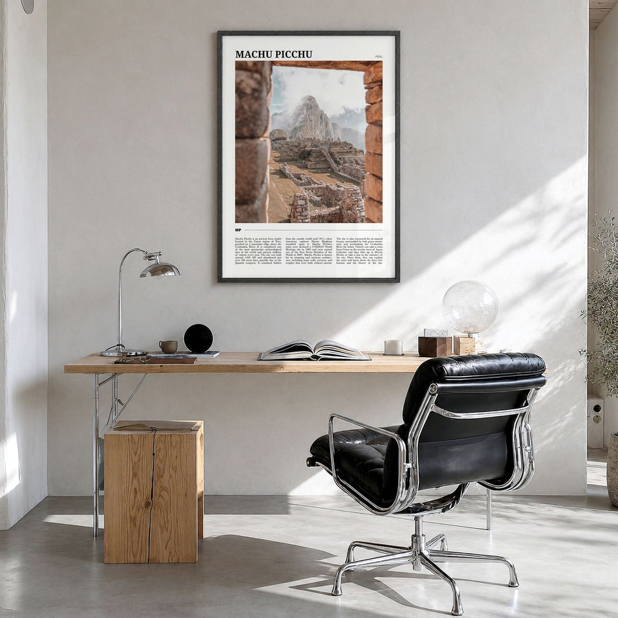 Machu Picchu Travel Poster in a black wood frame, hanging in a bright home office