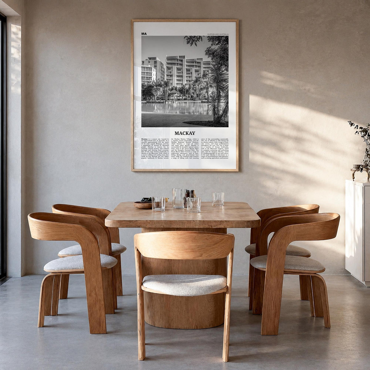 Mackay black & white newspaper poster of Australia – vertical wall art in natural wood frame, hanging on wall