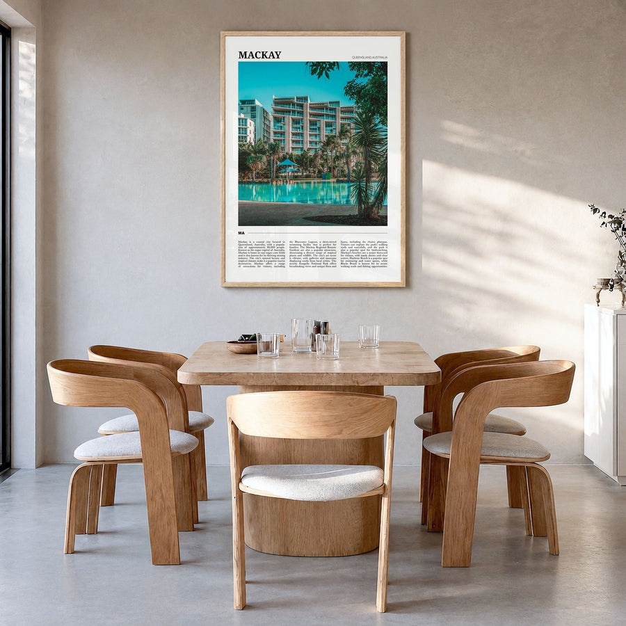Mackay Travel Poster in a natural wood frame, hanging in a dining room