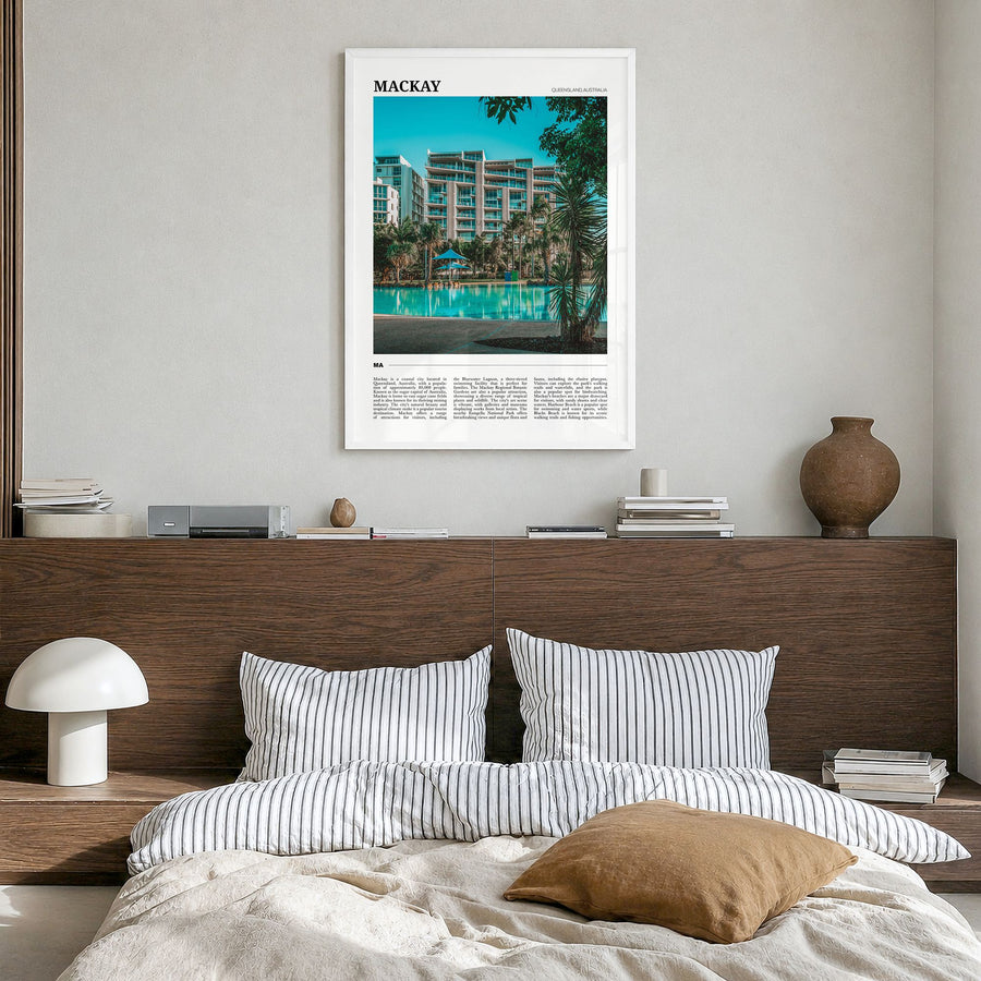 Mackay Travel Poster in a white wood frame, hanging in a bedroom