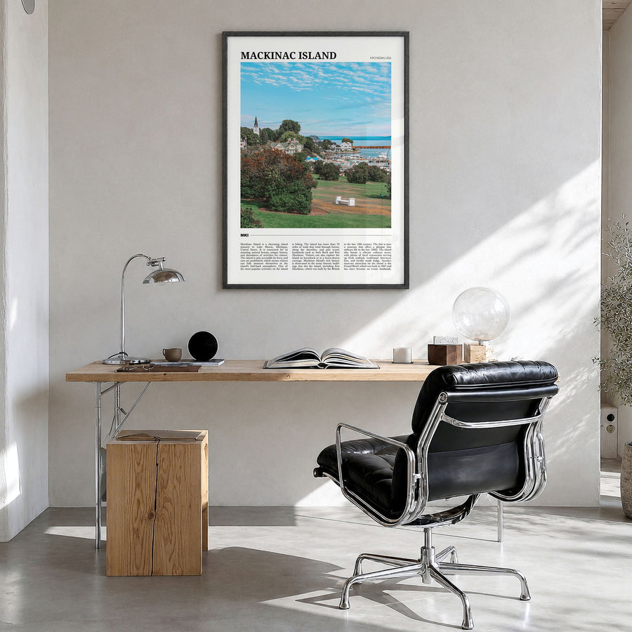 Mackinac Island Travel Poster in a black wood frame, hanging in a bright home office