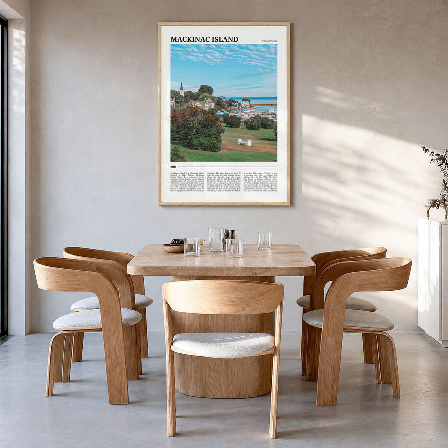 Mackinac Island Travel Poster in a natural wood frame, hanging in a dining room