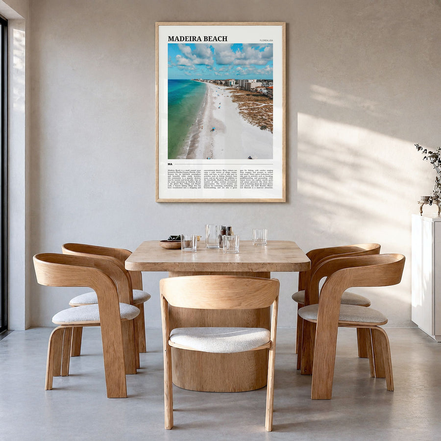 Madeira Beach Travel Poster in a natural wood frame, hanging in a dining room