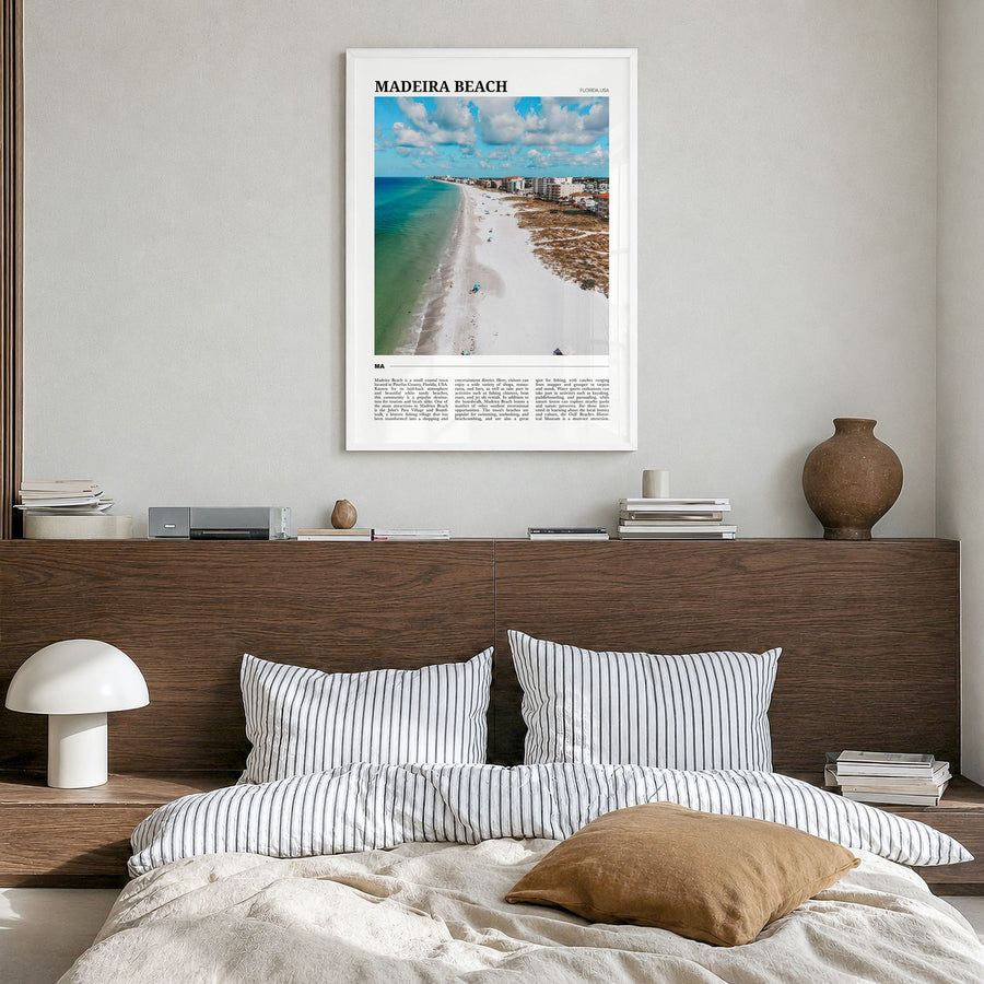 Madeira Beach Travel Poster in a white wood frame, hanging in a bedroom