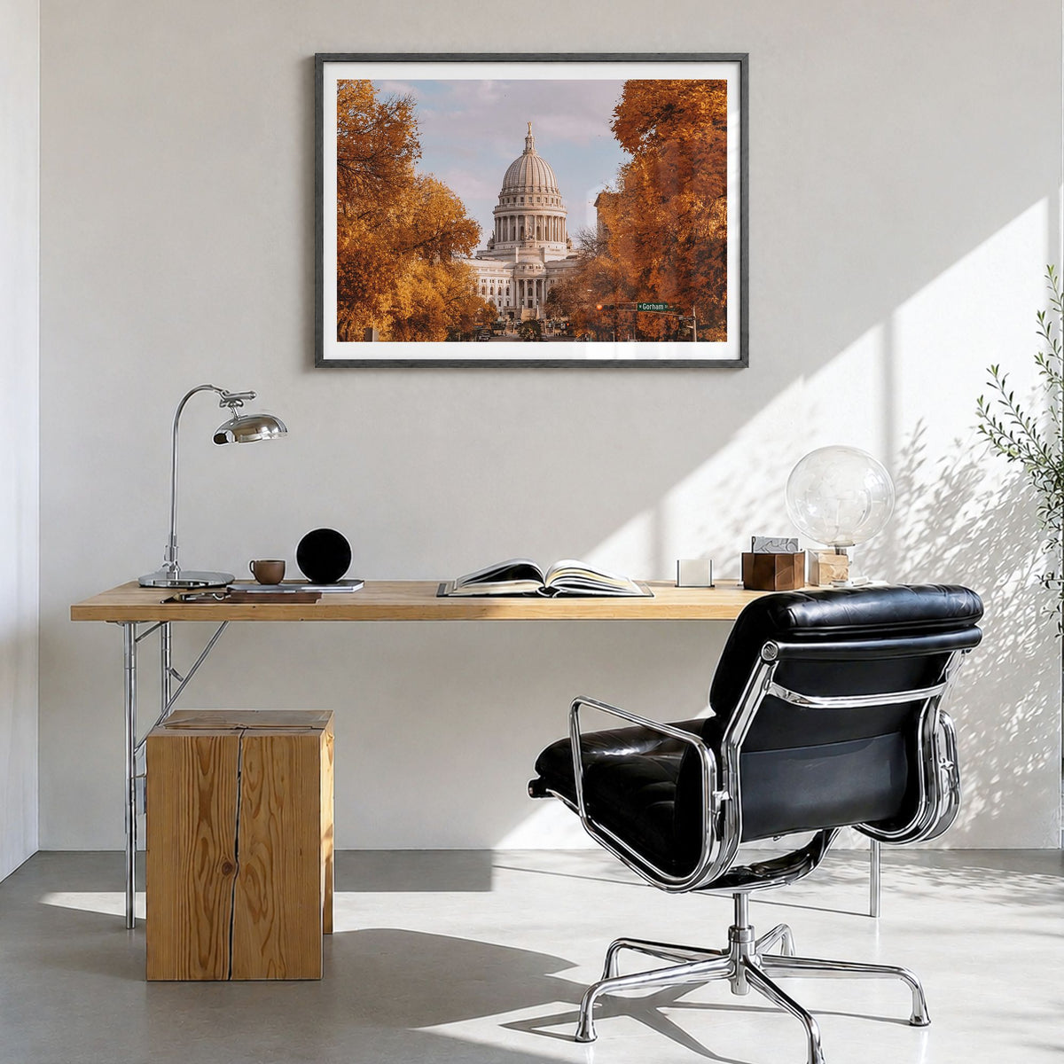 Madison Photo Poster in a black wood frame, hanging in a bright home office, white border