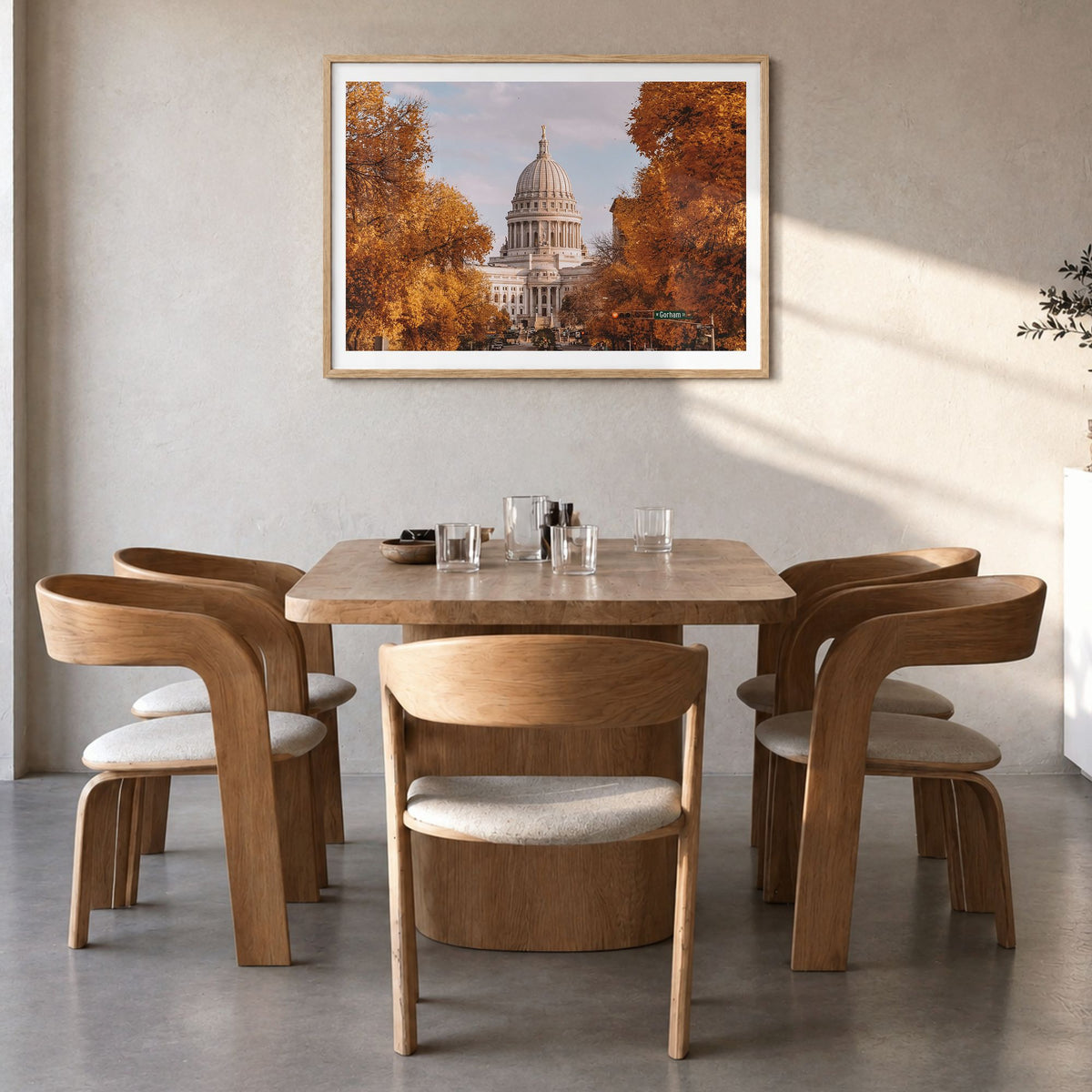 Madison Photo Poster in a natural wood frame, hanging in a dining room, white border