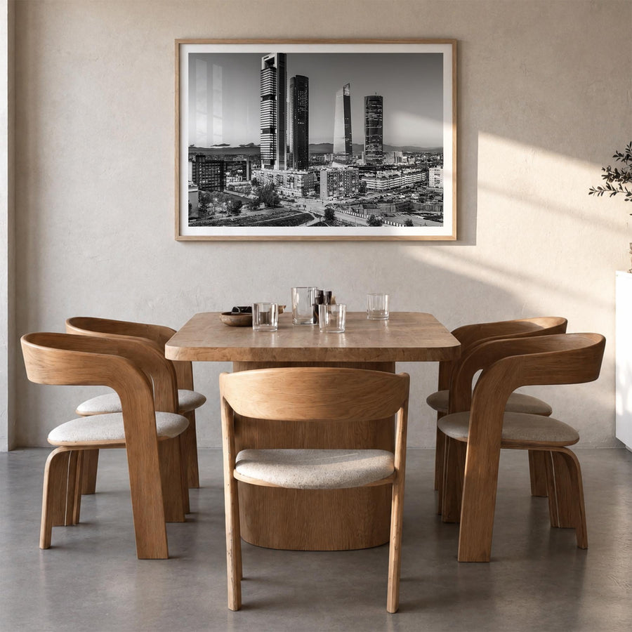 Madrid black & white photo poster of Spain – horizontal wall art in natural wood frame with white border, hanging on wall