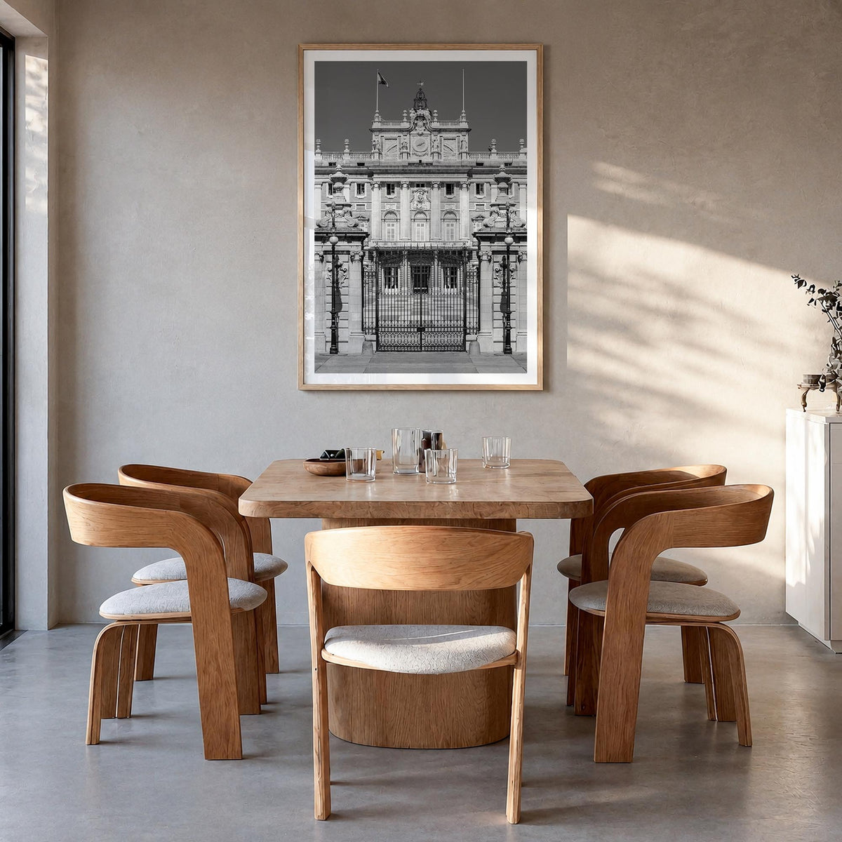 Madrid no. 2 black & white photo poster of Spain – vertical wall art in natural wood frame with white border, hanging on wall