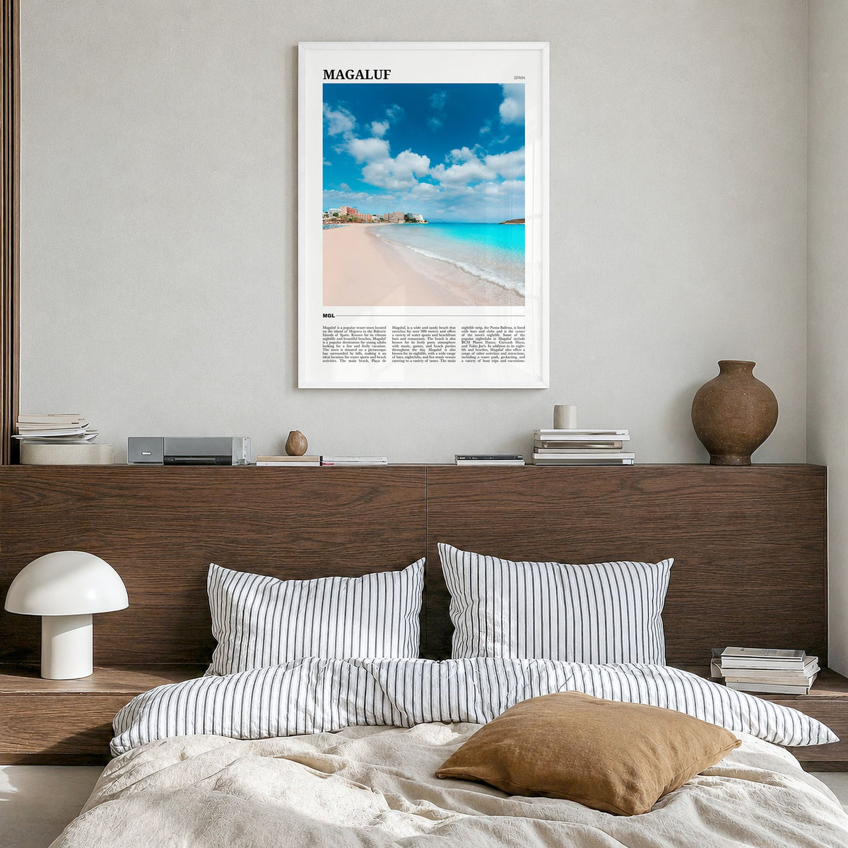 Magaluf Travel Poster in a white wood frame, hanging in a bedroom