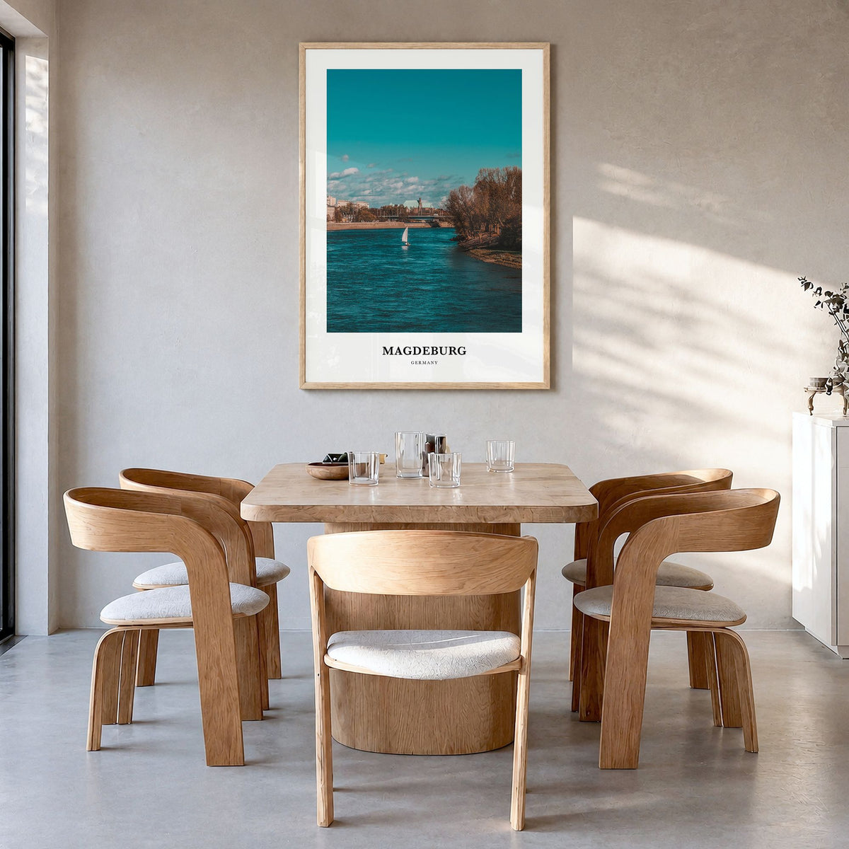 Magdeburg Classic No 1 Poster in a natural wood frame, hanging in a dining room