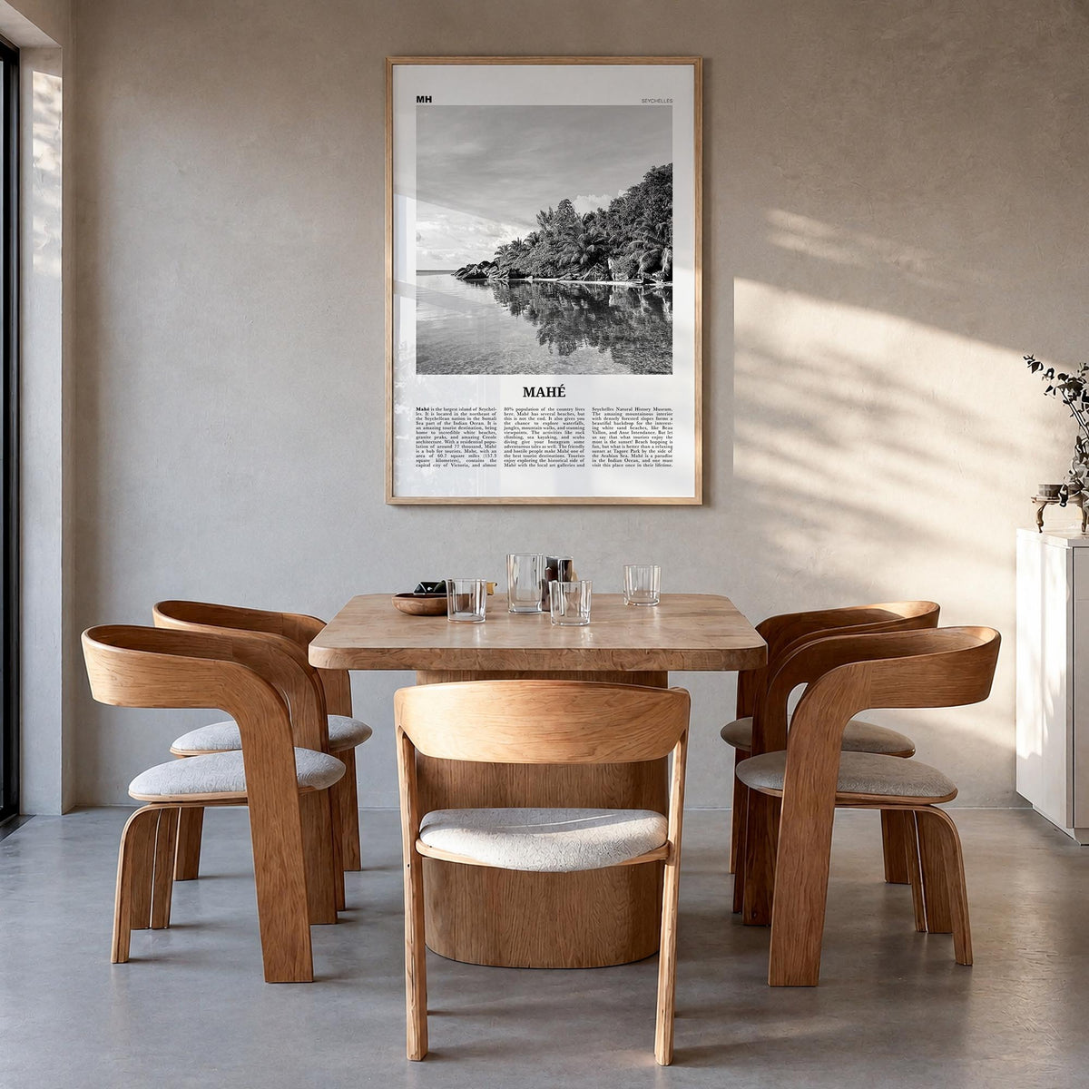 Mahé black & white newspaper poster of Seychelles – vertical wall art in natural wood frame, hanging on wall