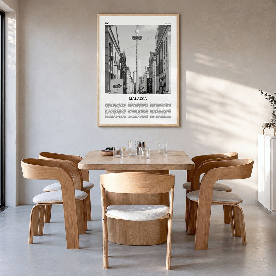 Malacca Newspaper Poster in a natural wood frame, hanging in a dining room