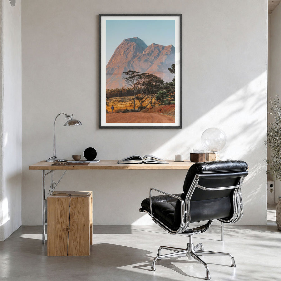 Malawi Photo Poster in a black wood frame, hanging in a bright home office, white border