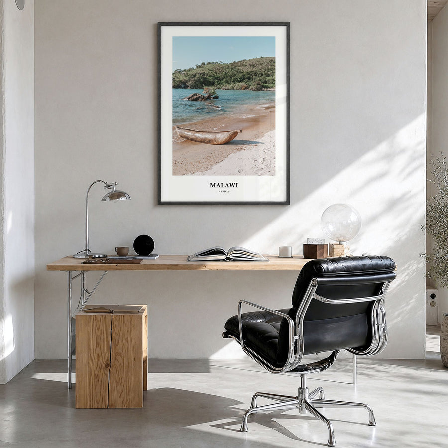 Malawi Classic Poster in a black wood frame, hanging in a bright home office