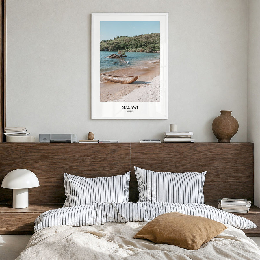 Malawi Classic Poster in a white wood frame, hanging in a bedroom