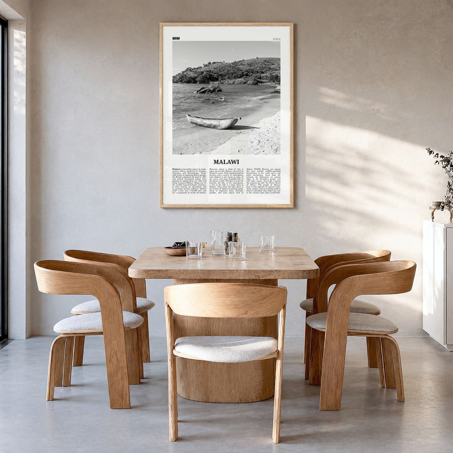 Malawi Newspaper Poster in a natural wood frame, hanging in a dining room