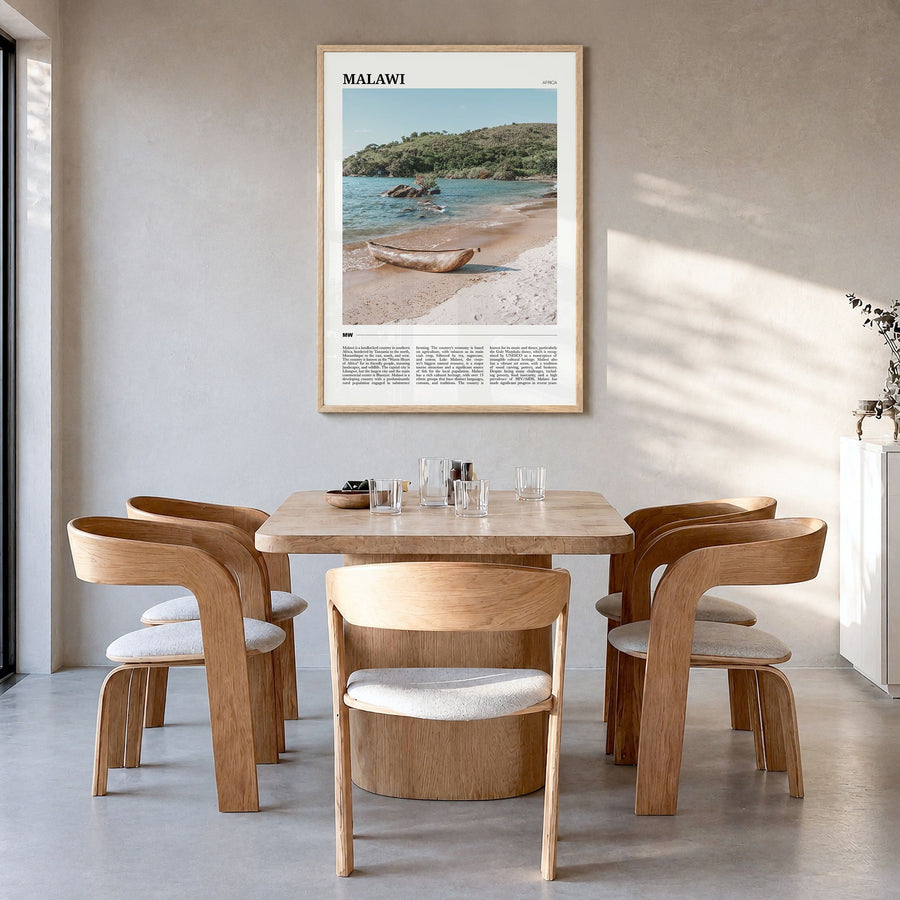 Malawi Travel Poster in a natural wood frame, hanging in a dining room