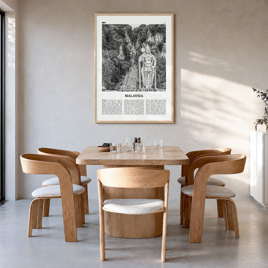 Malaysia Newspaper Poster in a natural wood frame, hanging in a dining room