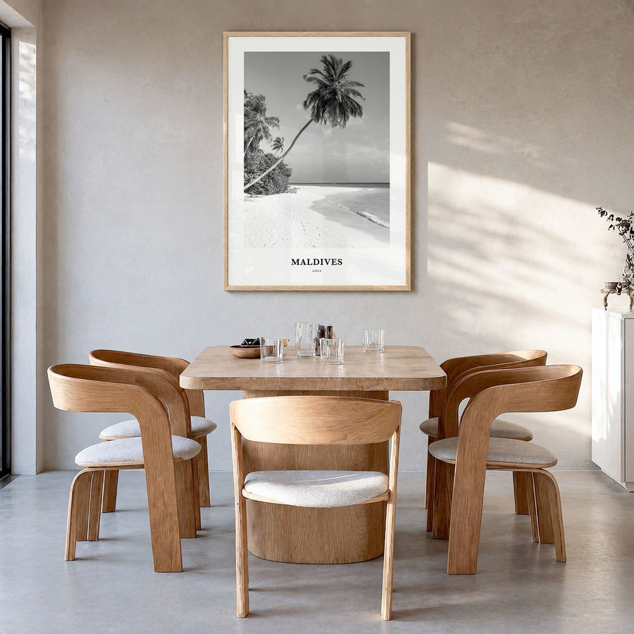 Maldives Classic No 1 Poster in a natural wood frame, hanging in a dining room