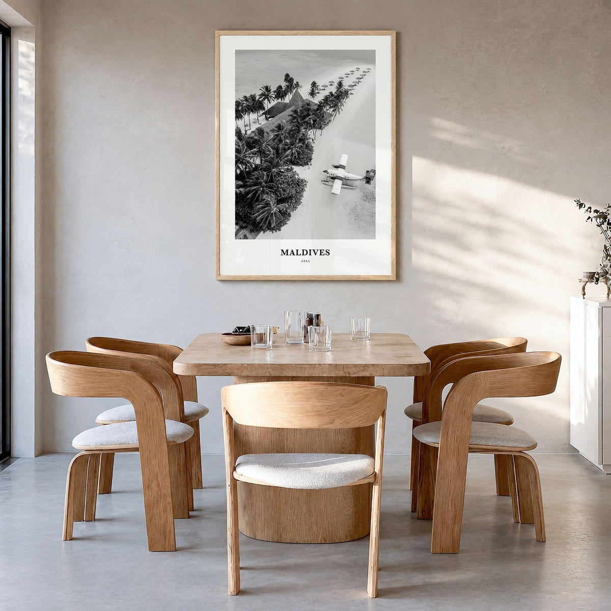 Maldives Classic No 3 Poster in a natural wood frame, hanging in a dining room