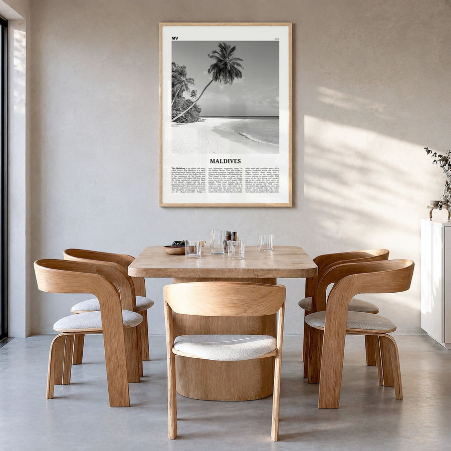 Maldives Newspaper No 1 Poster in a natural wood frame, hanging in a dining room