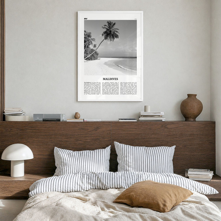 Maldives Newspaper No 1 Poster in a white wood frame, hanging in a bedroom