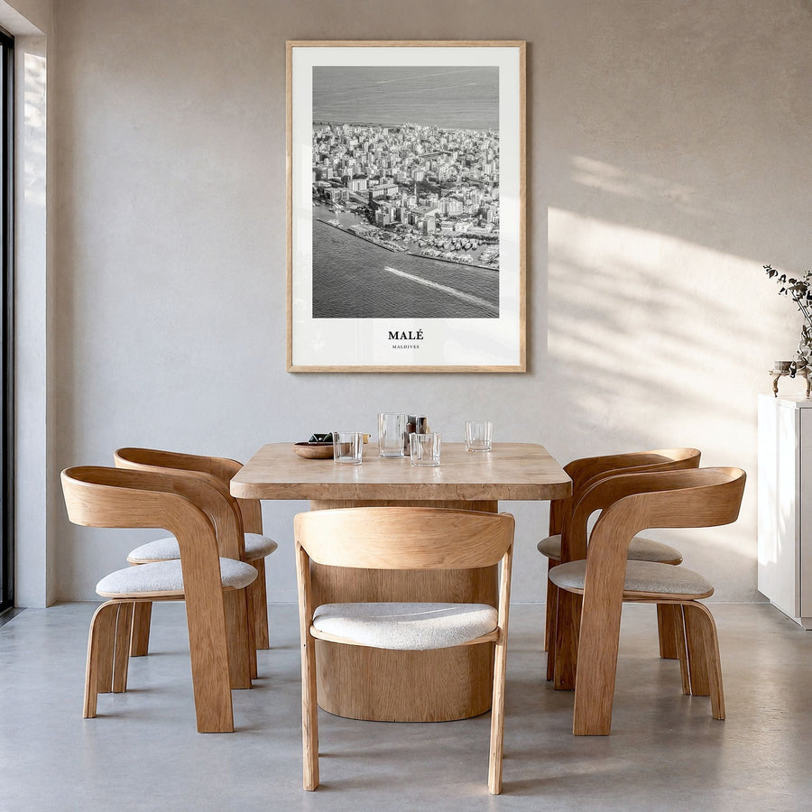 Malé Classic Poster in a natural wood frame, hanging in a dining room