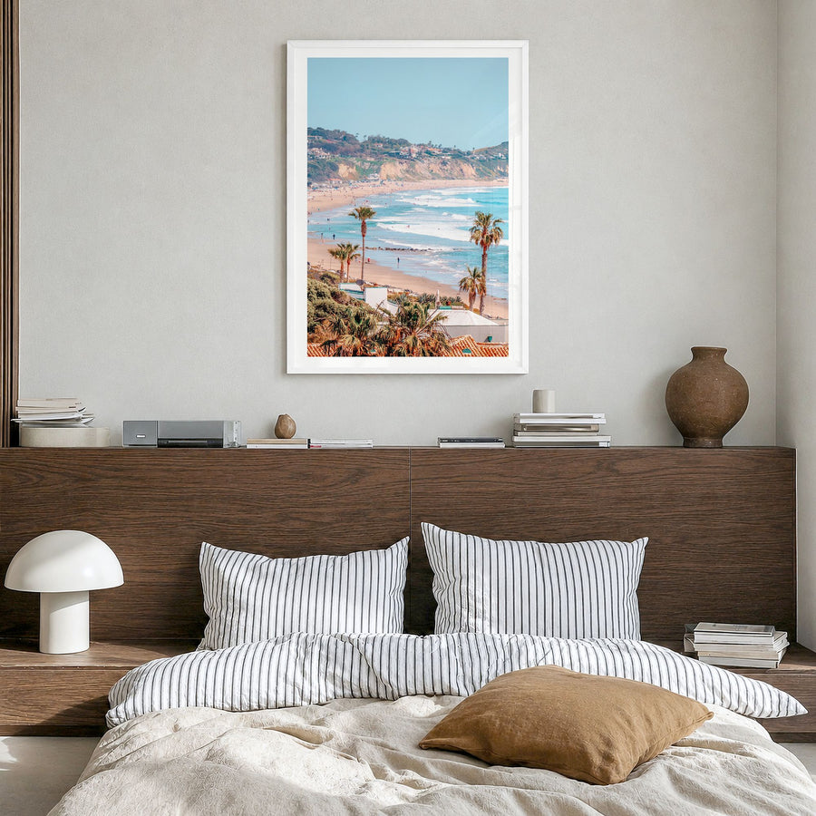 Malibu Photo No 1 Poster in a white wood frame, hanging in a bedroom, white border