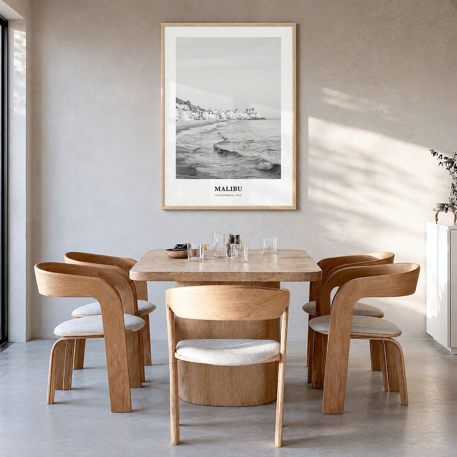 Malibu Classic No 1 Poster in a natural wood frame, hanging in a dining room