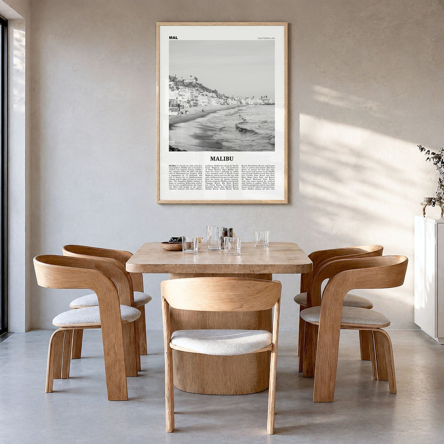Malibu Newspaper No 1 Poster in a natural wood frame, hanging in a dining room