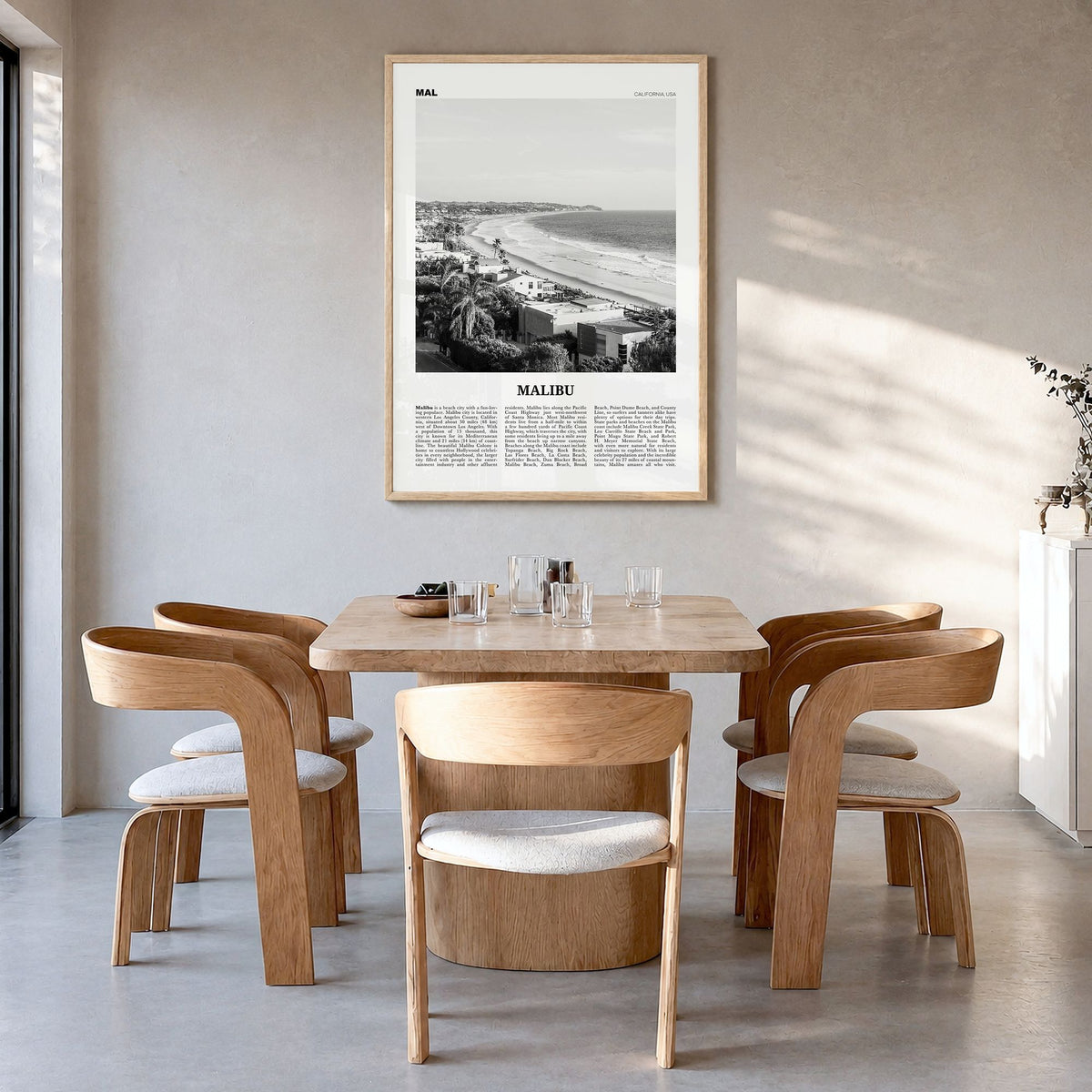 Malibu Newspaper No 2 Poster in a natural wood frame, hanging in a dining room