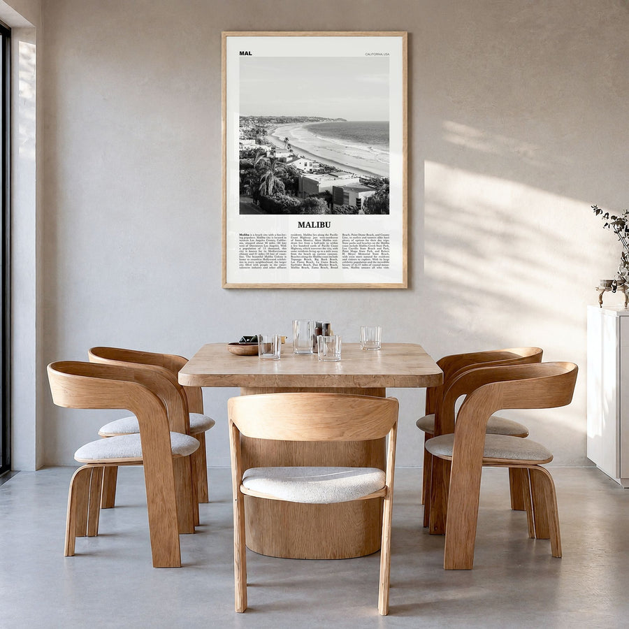 Malibu Newspaper No 2 Poster in a natural wood frame, hanging in a dining room