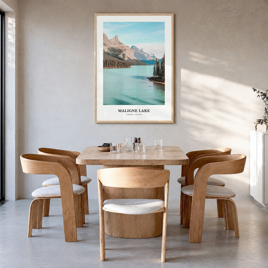 Maligne Lake Classic Poster in a natural wood frame, hanging in a dining room