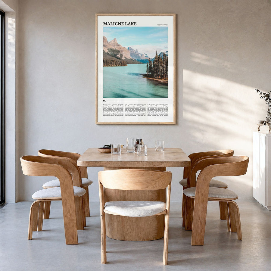 Maligne Lake Travel Poster in a natural wood frame, hanging in a dining room