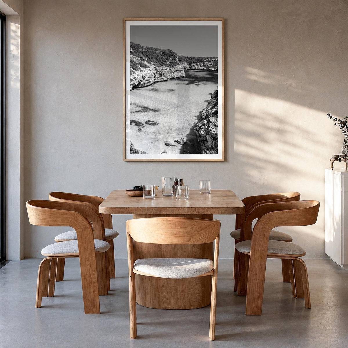 Mallorca black & white photo poster of Spain – vertical wall art in natural wood frame with white border, hanging on wall