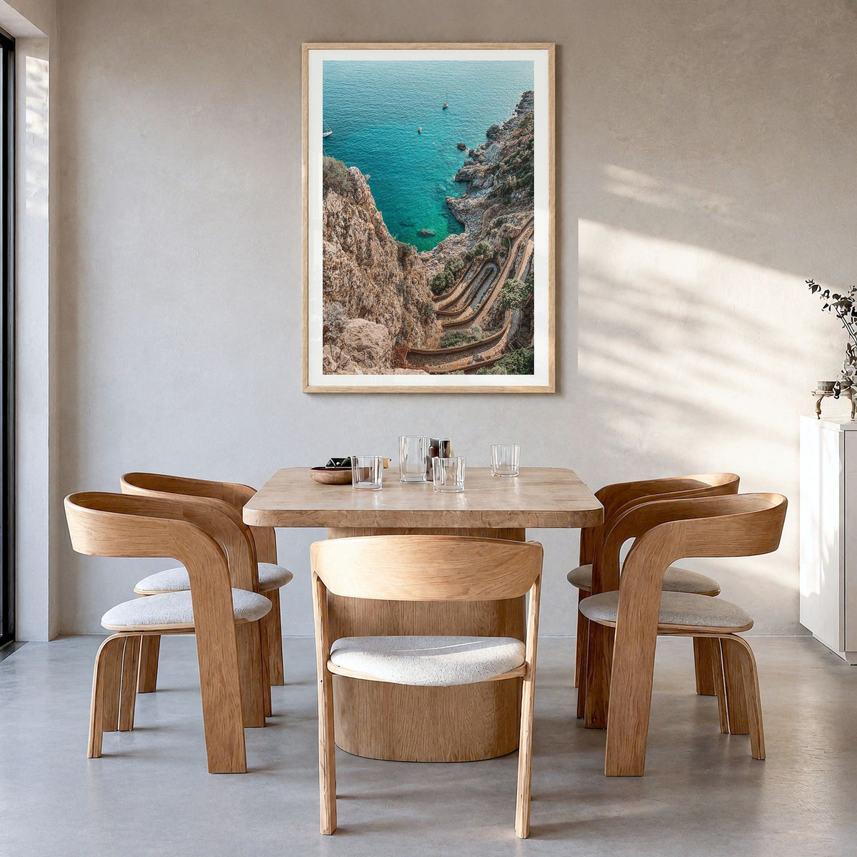 Mallorca Photo No 2 Poster in a natural wood frame, hanging in a dining room, white border