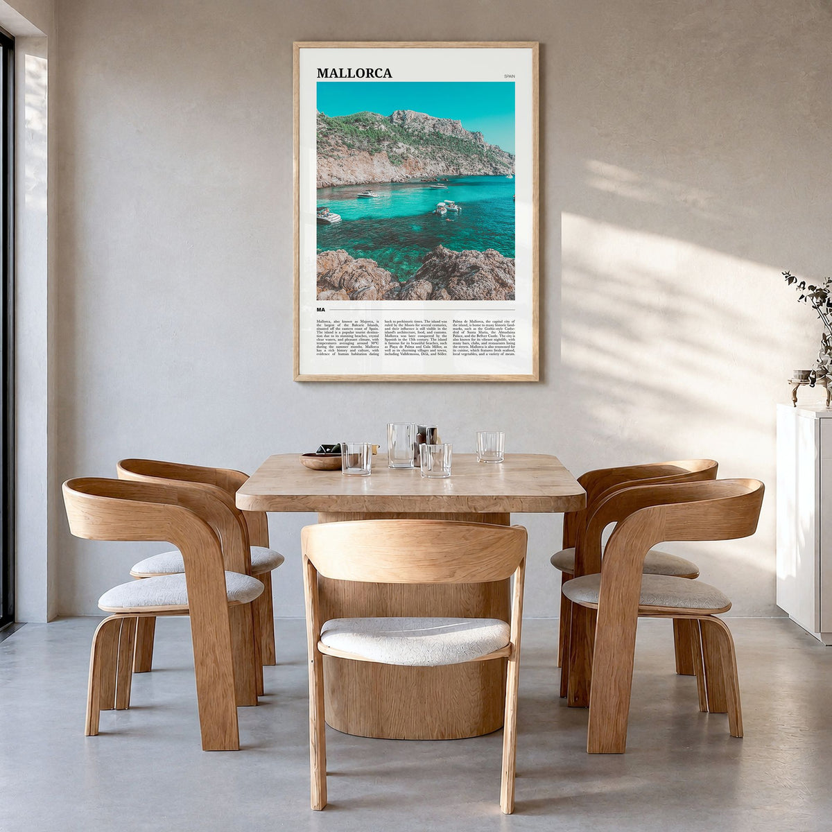 Mallorca Travel Poster in a natural wood frame, hanging in a dining room