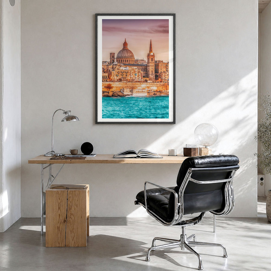 Malta Photo Poster in a black wood frame, hanging in a bright home office, white border