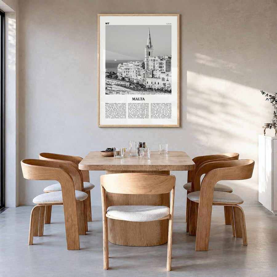 Malta Newspaper Poster in a natural wood frame, hanging in a dining room